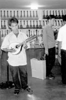 Randy’s mandolin being played at the Alegre Guitar factory.