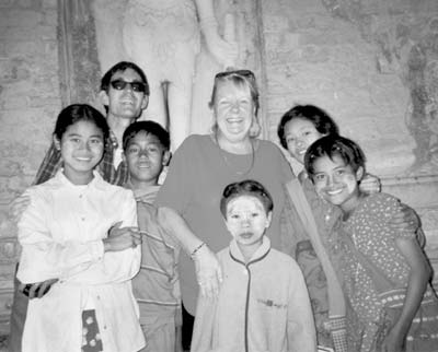 Kevin O’Brien (in sunglasses) and Jane O’Brien (center) with AA (at left in white blouse), Moo-Moo (center, front) and other children.