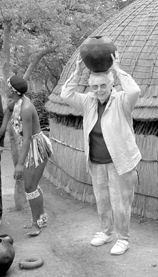At Shakaland Zulu Cultural Village, Estelle Burdige tries balancing a jug on her head 