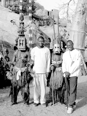 Malian doctors with Dogon dancers. Photo: Neilson