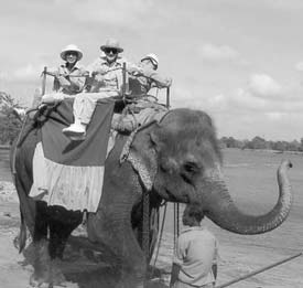 Martha Mangan and Kurt Kreuger on the elephant jungle ride.