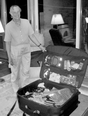 Ann with the foldable bicycle in its suitcase.