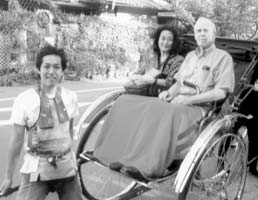 Mineko and Don McClure enjoy a rickshaw ride in Sagano.