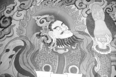 Brightly colored Buddhist paintings adorn the exterior walls of the temple at Jharkot.