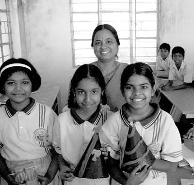 Schoolchildren and their teacher in Chennai, India. Photos: Robinson