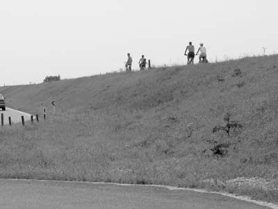 Bike riders pedal atop dikes in the countryside outside Amsterdam. Photos: Gail Taylor