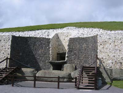 The southeast facade of Newgrange greets the morning sunrise. Only during the winter solstice does light pass through the unique roof box, located above the entrance.