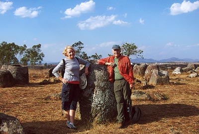 Hiking through the Plain of Jars, Richard and Pat Schally stop to compare the sizes of the many vessels.