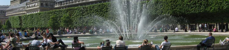 Parisians and visitors alike enjoying a beautiful day in the Jardin du Palais Royal.