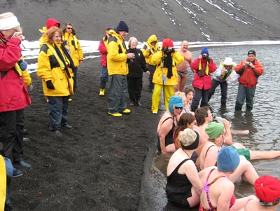 At Deception Island, daring passengers brave the cold air and relax in a spot of warm geothermal water.