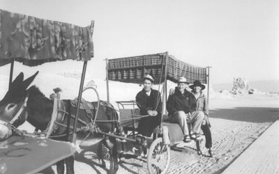 Ed and Nell McCombs on a donkey cart at the ruins of ancient Gaochang, China.