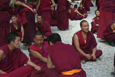 Monks engage in debate in the open-air courtyard at Sera Monastery.