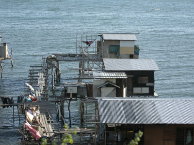 Life in a crowded fishing village’s stilt houses seems far removed from that in nearby modern Port Moresby.