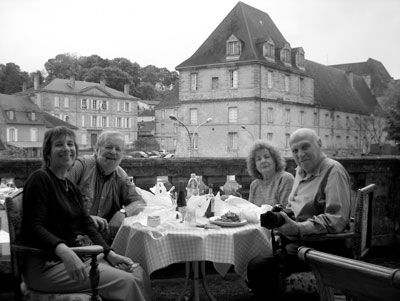 Nili, Jerry, Barbara and Harvey sitting on Connie Wilson’s balcony eating the lunch bought at the Saturday market in Sarlat. 