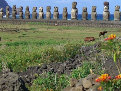 Wild horses and restored moai at Ahu Tongariki.