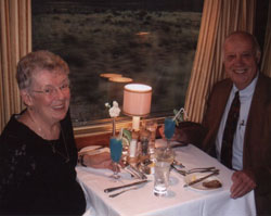 Nancy and Vern Hoium enjoying dinner in the dining car of the Blue Train.