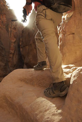 Bill Kizorek, KEENs on feet and tripod in hand, on the footpath to the Treasury in Petra, Jordan, in spring 2008. Photo by Jessica Kizorek