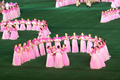 Performers at the Arirang Mass Games dressed in vivid pink outfits.