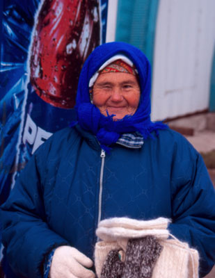 Volga fisherwoman selling gloves.