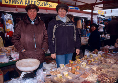 Vendors selling nuts in the open-air market in Kurgan.