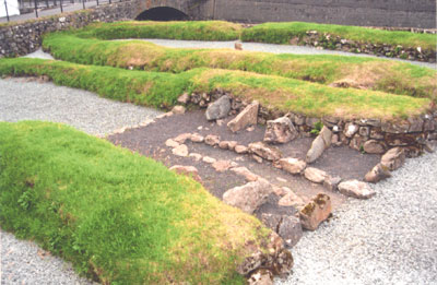 Viking archaeological site in Kvivik. The five spaces divided by stones indicate where cattle stalls once stood.