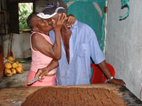 Left: Hoga Lalyn Ferma kissing her husband, who was cutting the “talbeta de coco,” or coconut candy.