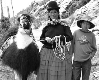 A llama, its mistress and her son, encountered on our way up the hill to Posada del Inca Eco-Lodge on Sun Island, Bolivia.