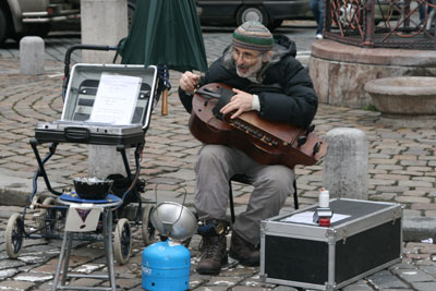 Hurdy-gurdy street musician in Prague.