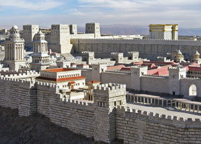 In this scale model, what is known as the Wailing Wall is beneath this portion of the wall surrounding the temple complex rebuilt by Herod over the site of the original temple in Jerusalem. Herod“s Temple (rectangular) is to the left in the foreground, and in the background are the four crenellated towers of the Antonia Fortress. 