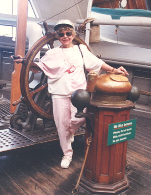 Paige Palmer at the wheel of the historic, Arctic-exploring schooner Fram.