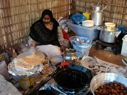 One of several ladies cooking chabab at the Heritage Village. 