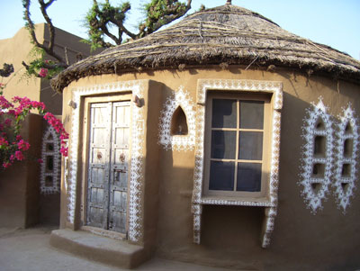 Our “mud hut” accommodation at Mandawa Desert Resort was decorated with designs in white lime paste.