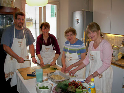Some of the members of our tour group preparing a Bolognese dinner at the home of our hostess, Raffaella Tori (second from left).