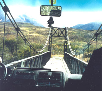 Crossing the narrow bridge in Torres de Paine National Park, with the torres (towers) in the background.  Photos: Burke