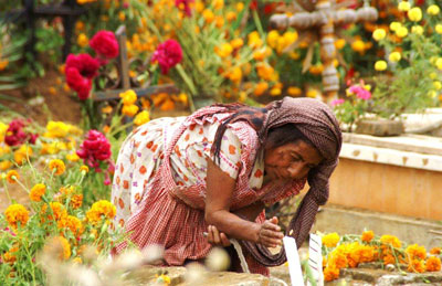 A visitor at the cemetery in Xoxocotlán.