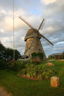 A beautifully maintained stone windmill located in the countryside near Gauja National Park, Latvia.