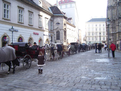 A young girl engages a carriage driver near St. Stephen’s Cathedral just off Kärntnerstrasse in Vienna.