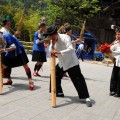 Musicians of the Dong minority playing handcrafted wooden instruments.