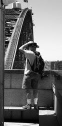Man standing on the pylon observation deck with the Sydney Harbour Bridge behind him. Photo: Olander