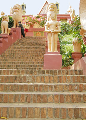 Guardians flank the stairway up to Wat Phnom. Photo: Patten
