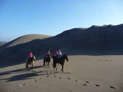 The Shusterman / Greenwell family riding in the Ritoque Dunes — Concón, Chile. Photo: Marty Greenwell