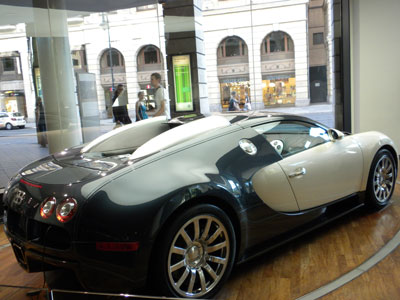The Bugatti in the window of the Automobil­forum. 