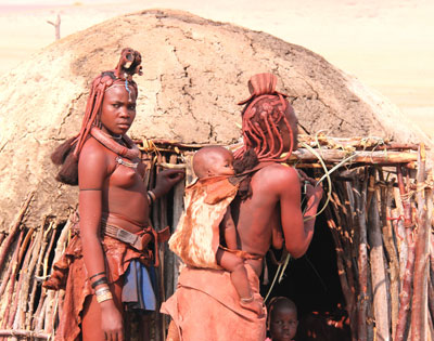 Himba women in front of their hut.