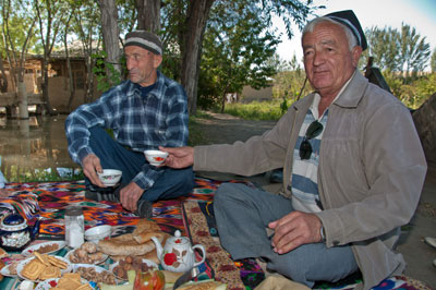 Our guide Hamrokul Mirzoev (right) with Jaliloov Razshan, who hosted an impromptu lunch for us near Panjakent, Tajikistan.
