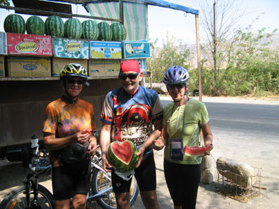 Ann, Art and Julane enjoying a fresh melon at a roadside stand.