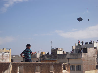 Boys and men take to the rooftops to fly their kites — Jaipur. Photos: Solender