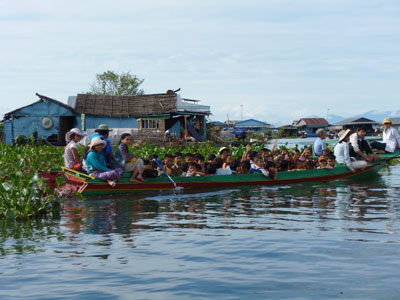 The morning ride to school looks a little different in the floating village of Chnok Trou.