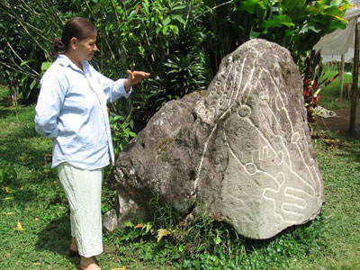 Edna Landau, owner of Sitio Barriles, an archaeological site located on her family’s farm, explained a petroglyph map. 