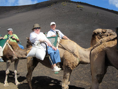 Stewart Winn (center right) and his wife, Dial, on camelback on Lanzarote, Canary Islands (taken with a Canon Powershot SD 780 IS).