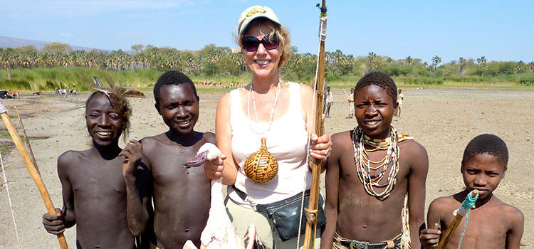 Suzi Colman shows off the flamingo found on her outing with the Hadza huntsmen.